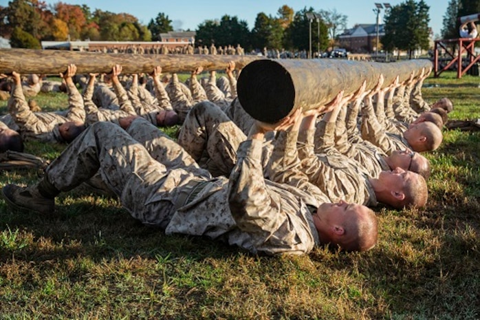 U.S. Marine officer candidates with the Officer Candidate School conduct log presses for training at Marine Corps Base Quantico, Va., Nov. 7, 2018.
