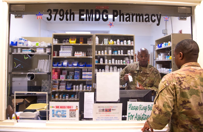 Capt. Alexander Brown, 379th Expeditionary Medical Group (EMDG) pharmacy element chief, interacts with a customer at the 379th EMDG pharmacy Jan. 15, 2019, at Al Udeid Air Base, Qatar. Airmen who work at the 379th EMDG pharmacy dispense medications to all military personnel as part of their over-the-counter medication program. Patients can receive over-the-counter “cold-packs” without seeing a doctor as part of a self-help program designed to get patients in and out of the hospital so they can return to work and focus on the mission. (U.S. Air Force photo by Tech. Sgt. Christopher Hubenthal)
