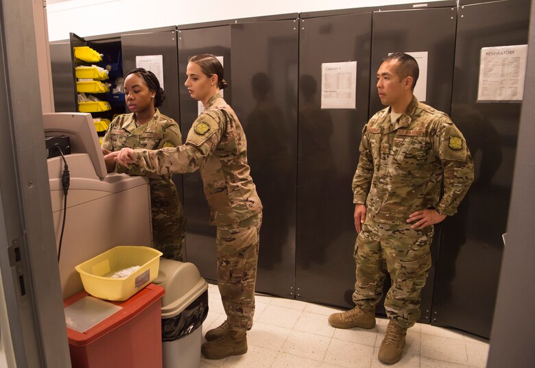 From left to right, Staff Sgt. Shakita Thomas, Staff Sgt. Victoria Keyes, and Tech. Sgt. Thoney Douangnoy, all assigned to the 379th Expeditionary Medical Group (EMDG) pharmacy, refill stock for the clinic’s intensive care unit Jan. 15, 2019, at Al Udeid Air Base, Qatar. Airmen who work at the 379th EMDG support warfighters in a variety of ways including dispensing medications to all military personnel and equipping forward deployers with biological and chemical warfare kits. (U.S. Air Force photo by Tech. Sgt. Christopher Hubenthal)