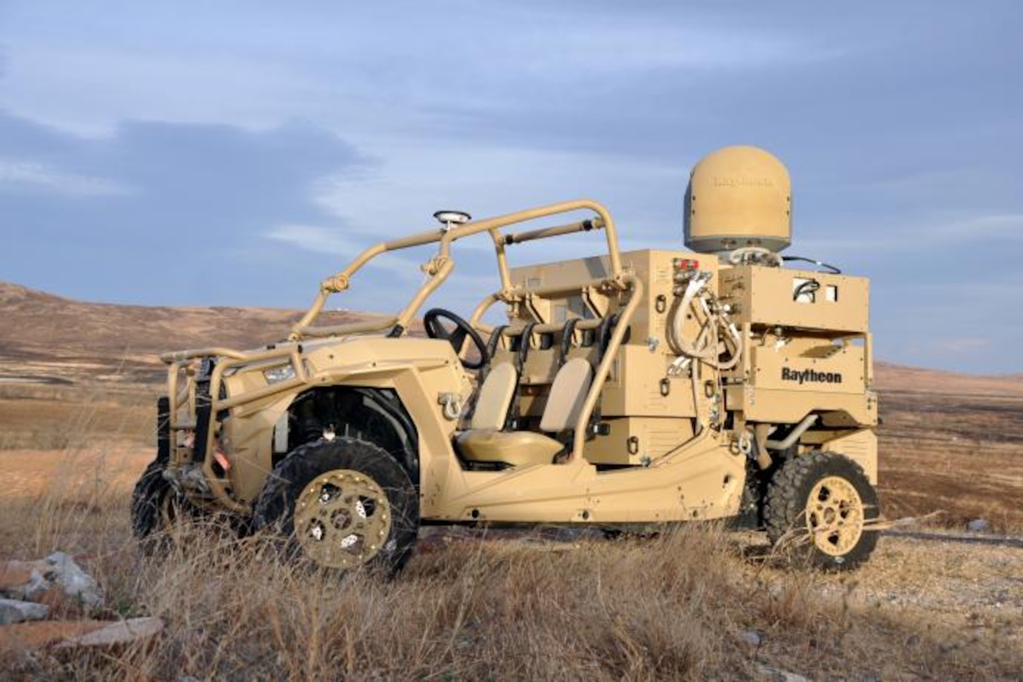 This is the Raytheon laser dune buggy, a solid-state laser combined with an advanced variant of the company’s Multi-Spectral Targeting System of sensors, installed on a small, all-terrain Polaris militarized vehicle. Coupled with a generator, the HEL weapon system provides military members with counter-UAV capabilities and a virtually unlimited magazine. The Raytheon High Energy Laser Weapon System as mounted on a light tactical vehicle was one of two Directed Energy systems that participated at the October 2018 experimentation event at White Sands Missile Range, New Mexico. The event was held as part of the Directed Energy Experimentation Campaign, which is headed by the 704th Test Group DE Combined Test Force. (U.S. Army photo by Monica K. Guthrie)