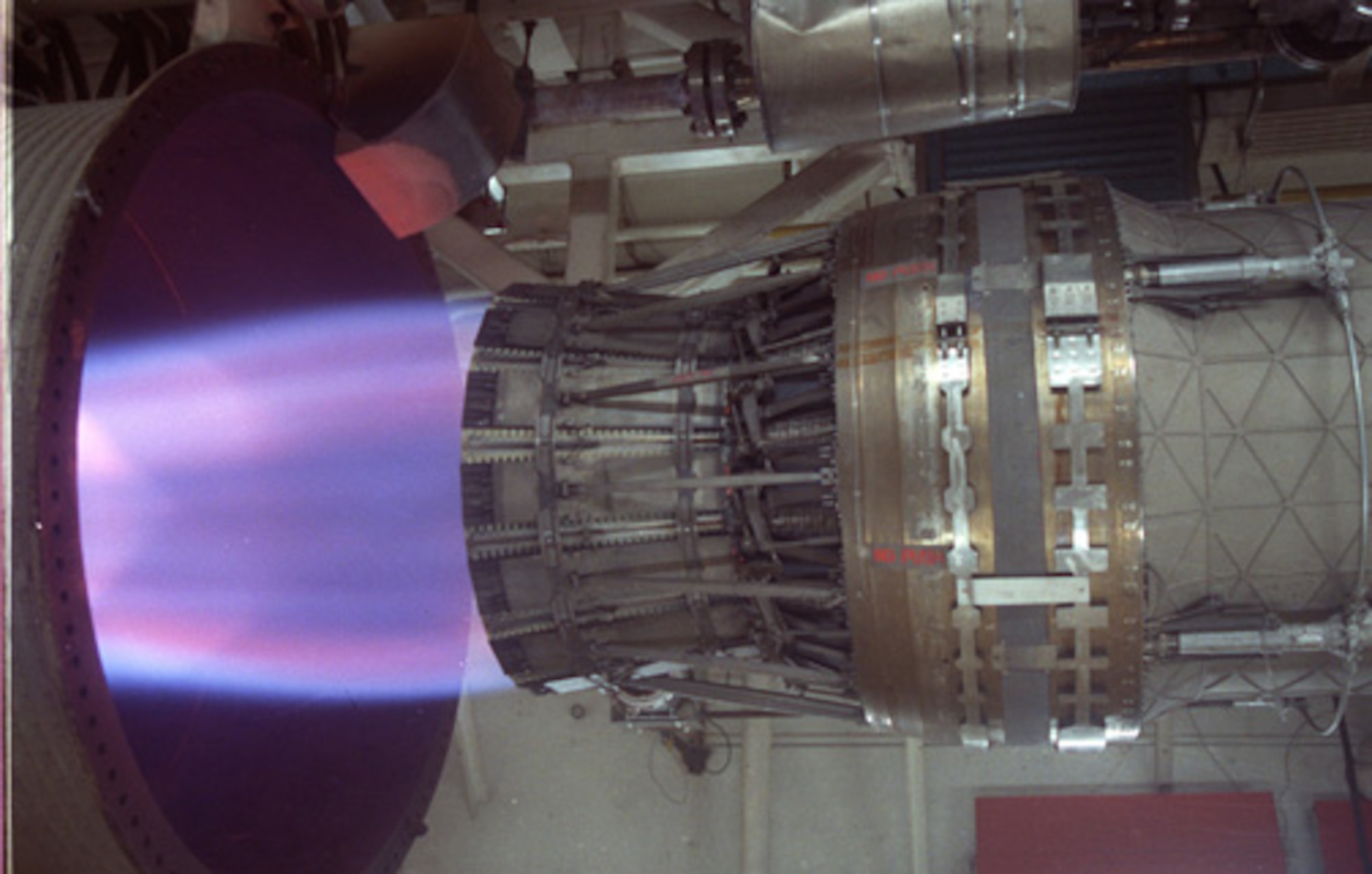 A F100-PW-229 ram engine, which powers the F-15 Eagle and F-16 Fighting Falcon, undergoes accelerated mission testing in the in J-1 engine test cell at Arnold Air Force Base. (U.S. Air Force photo)