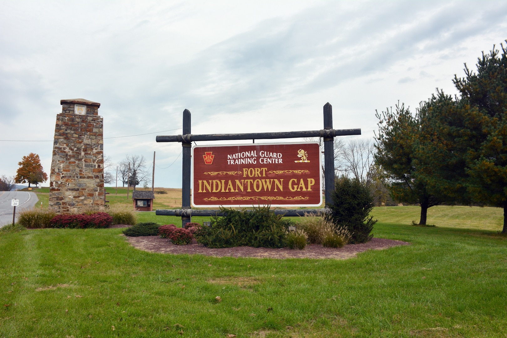 A Fort Indiantown Gap Training Center sign located at the southwest entrance to the post along Fisher Avenue welcomes visitors to the installation. Oct. 31, 2018.