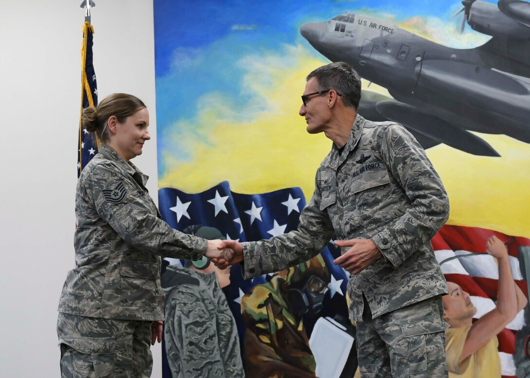 A mural painted by Tech. Sgt. Marlene Scarpino,  an aircraft maintenance specialist assigned to the 910th Maintenance Squadron, portrays the 910th Maintenance Squadron’s role in the success of the wing’s C-130 flying missions.