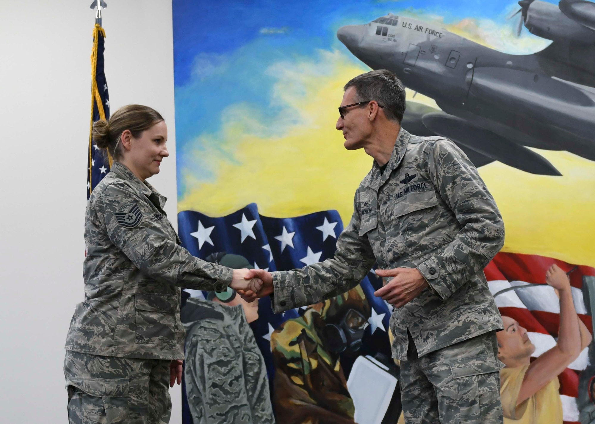 A mural painted by Tech. Sgt. Marlene Scarpino,  an aircraft maintenance specialist assigned to the 910th Maintenance Squadron, portrays the 910th Maintenance Squadron’s role in the success of the wing’s C-130 flying missions.