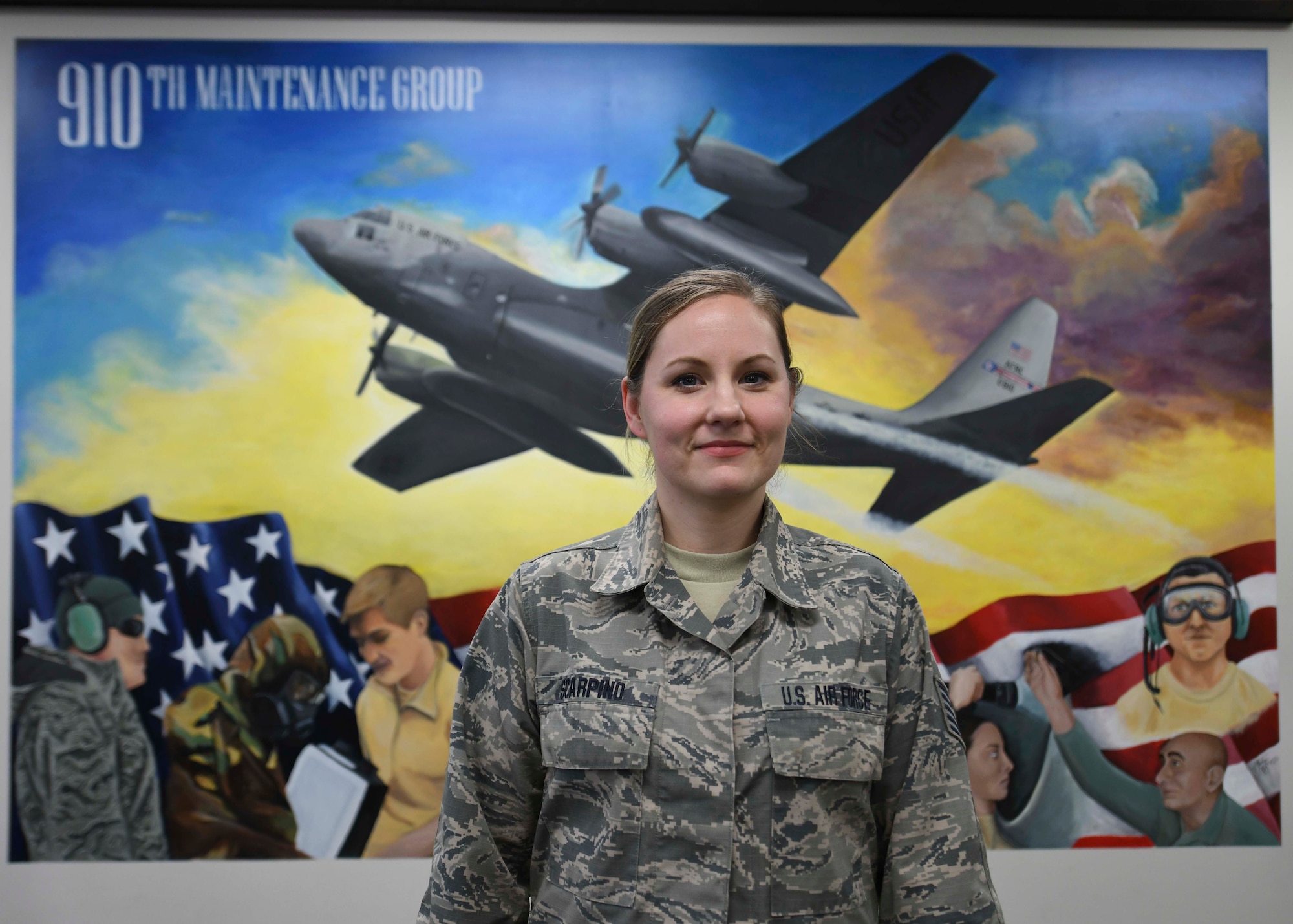 A mural painted by Tech. Sgt. Marlene Scarpino,  an aircraft maintenance specialist assigned to the 910th Maintenance Squadron, portrays the 910th Maintenance Squadron’s role in the success of the wing’s C-130 flying missions.