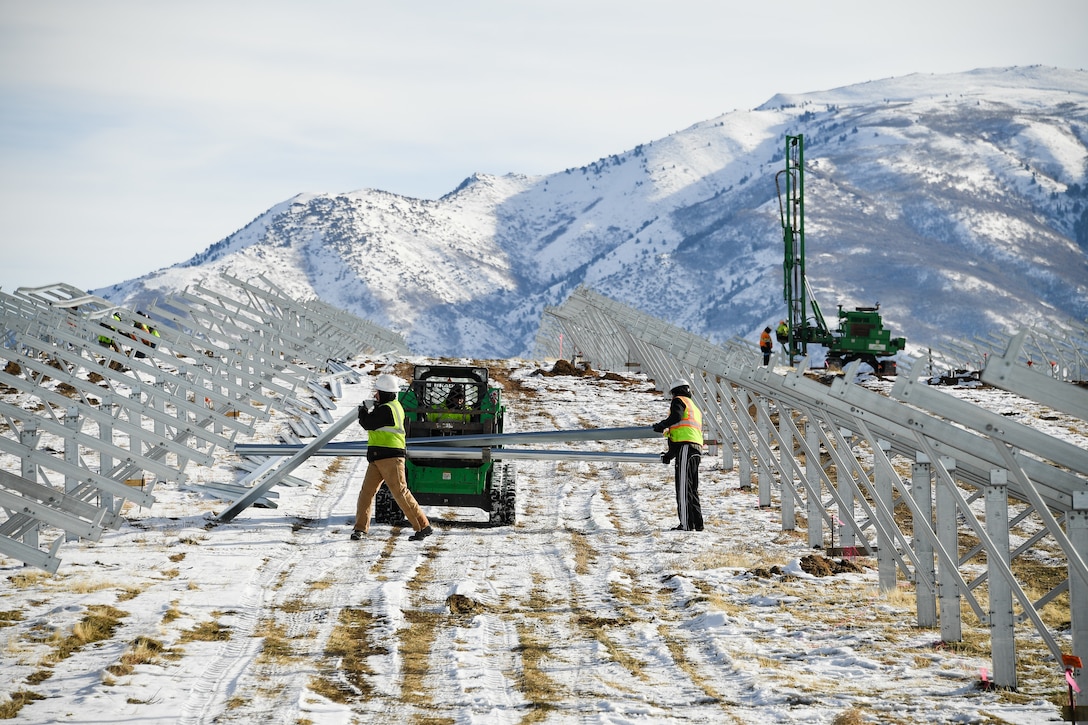 Crews work on installing the rack system for a new solar array at Hill Air Force Base, Utah, Dec. 12, 2018.