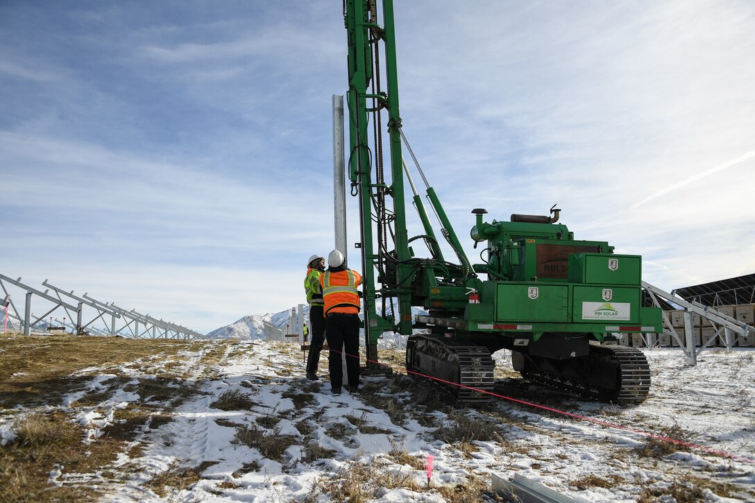 Posts are driven into the ground by a crew installing a new solar array at Hill Air Force Base, Utah, Dec. 14, 2018.