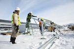 A construction crew works on the new solar array being installed at Hill Air Force Base, Utah, Jan. 9, 2018.