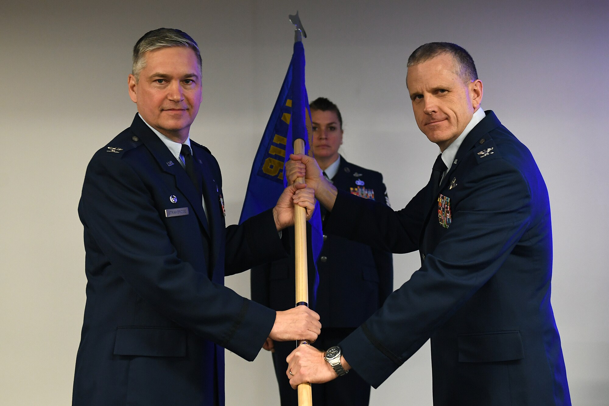 Col. Gregory D. Buchanan, commander of the 911th Operations Group, accepts the guide-on from 911th Airlift Wing Commander Col. Douglas N. Strawbridge during an assumption of command ceremony at the Pittsburgh International Airport Air Reserve Station, Pennsylvania, Jan. 6, 2019. Buchanan assumed command after having served a total of over two years as the interim 911th OG commander during various deployments and contingencies. (U.S. Air Force photo by Tech. Sgt. Marjorie A. Schurr)