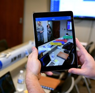A demonstrator shows how augmented reality can be used to view floating dialogue boxes for individual parts of a mock missile during a demonstration Jan. 8, 2019, at Joint Base Langley-Eustis, Virginia. Augmented reality is one way Airmen could use advanced technology to enhance their training in the field.