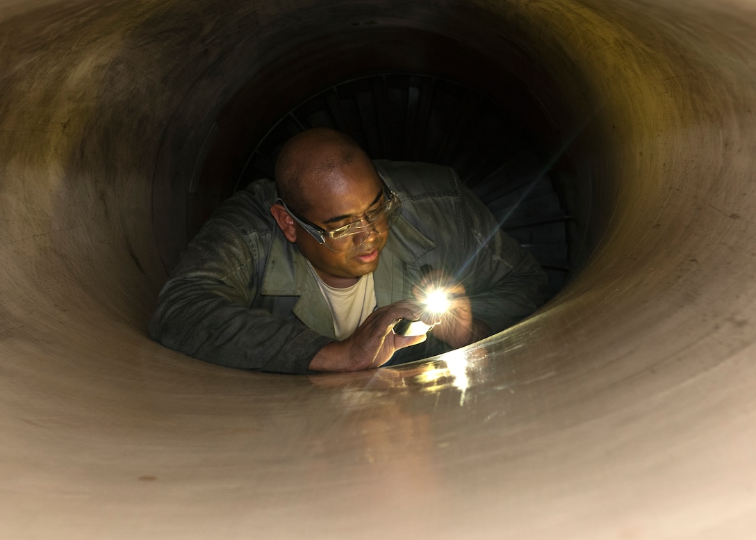 Staff Sgt. Willie Moore, a 56th Equipment Maintenance Squadron phase team member, inspects the engine of an F-16 Fighting Falcon at Luke Air Force, Ariz., Jan. 15, 2019.