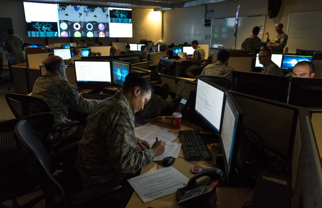 Cyber warfare operators serving with 175th Cyberspace Operations Group of Maryland Air National Guard monitor cyber attacks on operations floor of 275th Cyber Operations Squadron known as Hunter’s Den, December 2, 2017 (U.S. Air Force/J.M. Eddins, Jr.)