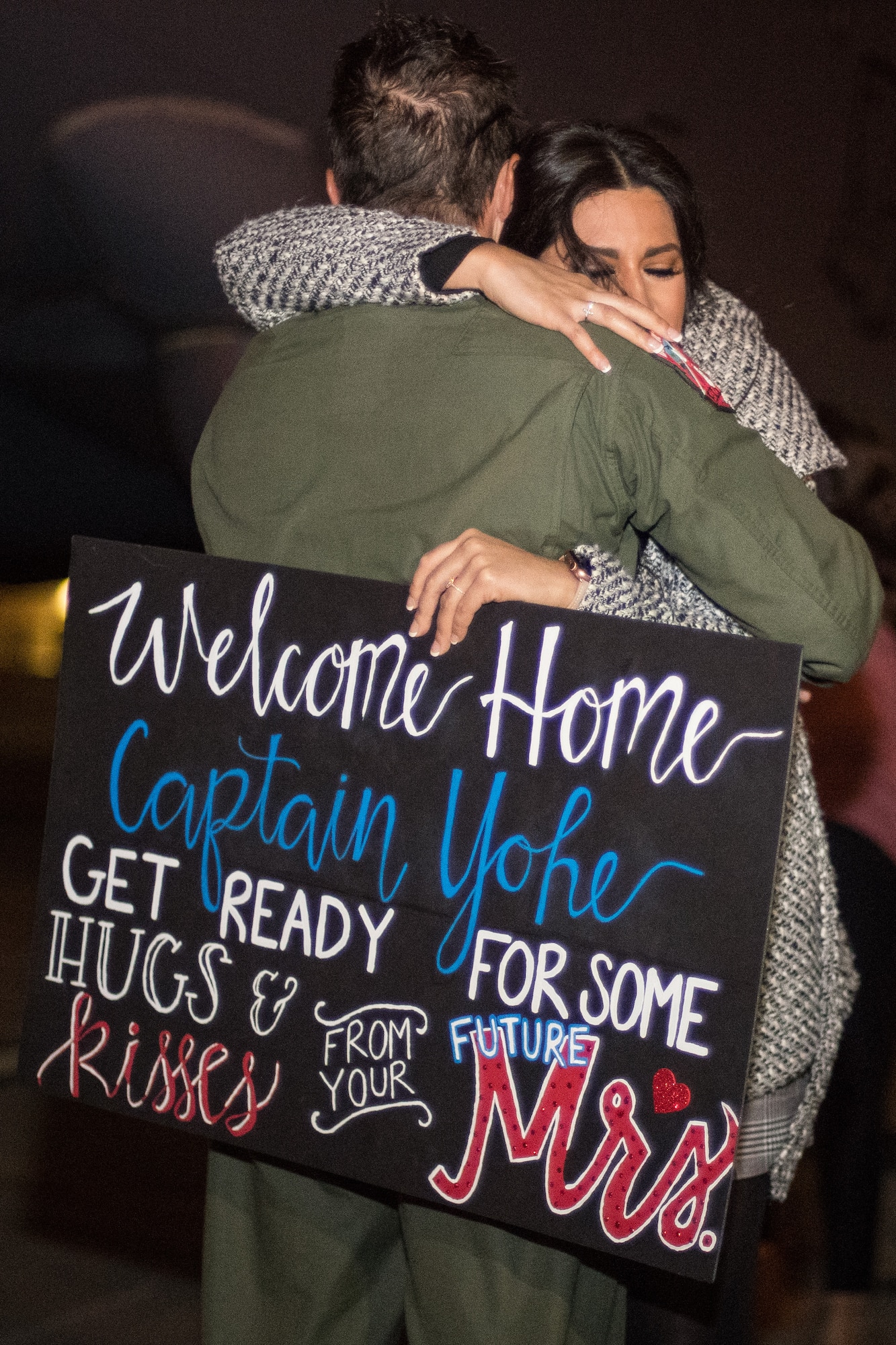 Capt. Kyle Yohe, 96th Bomb Squadron flight commander, embraces his fiancé Capt. Sarah D’Alessandro after returning from a deployment at Barksdale Air Force Base, La., Jan. 16, 2019. Yohe and his team deployed to Andersen Air Force Base, Guam for six months in support of Continuous Bomber Presence. (U.S. Air Force photo by Airman 1st Class Lillian Miller)