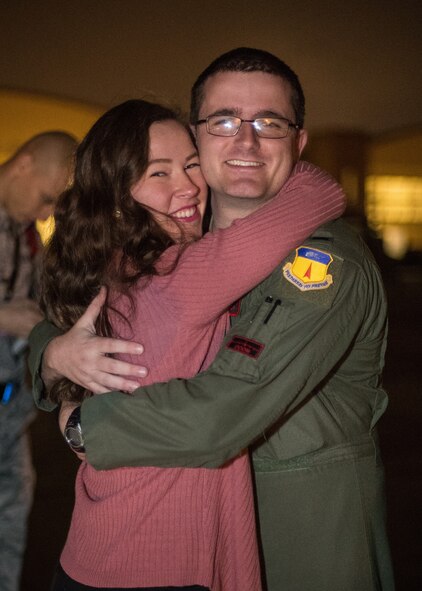 Capt. Kyle Yohe, 96th Bomb Squadron flight commander, embraces his fiancé Capt. Sarah D’Alessandro after returning from a deployment at Barksdale Air Force Base, La., Jan. 16, 2019. Yohe and his team deployed to Andersen Air Force Base, Guam for six months in support of Continuous Bomber Presence. (U.S. Air Force photo by Airman 1st Class Lillian Miller)