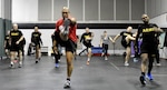 A U.S. Army Soldiers assigned to the 629th Military Intelligence Battalion receive instruction on proper stretching and warm-up techniques in preparation of the Army Combat Fitness Test Jan. 14, 2019, at Camp Fretterd Military Reservation in Reisterstown, Md.