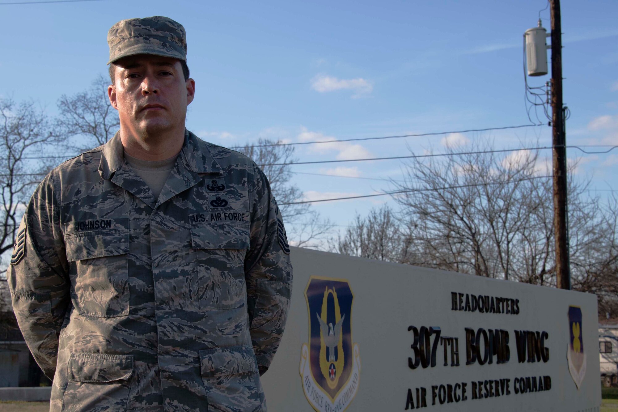 U.S. Air Force Master Sgt. Macord Johnson, 307th Force Support Squadron career assistance advisor, stands in front of the 307th Bomb Wing Headquarters building Jan. 17, 2019.   Johnson plays a vital role in helping Reserve Citizen Airmen of the unit make career decisions and better understand benefits available to them. (U.S. Air Force photo by Master Sgt. Ted Daigle)