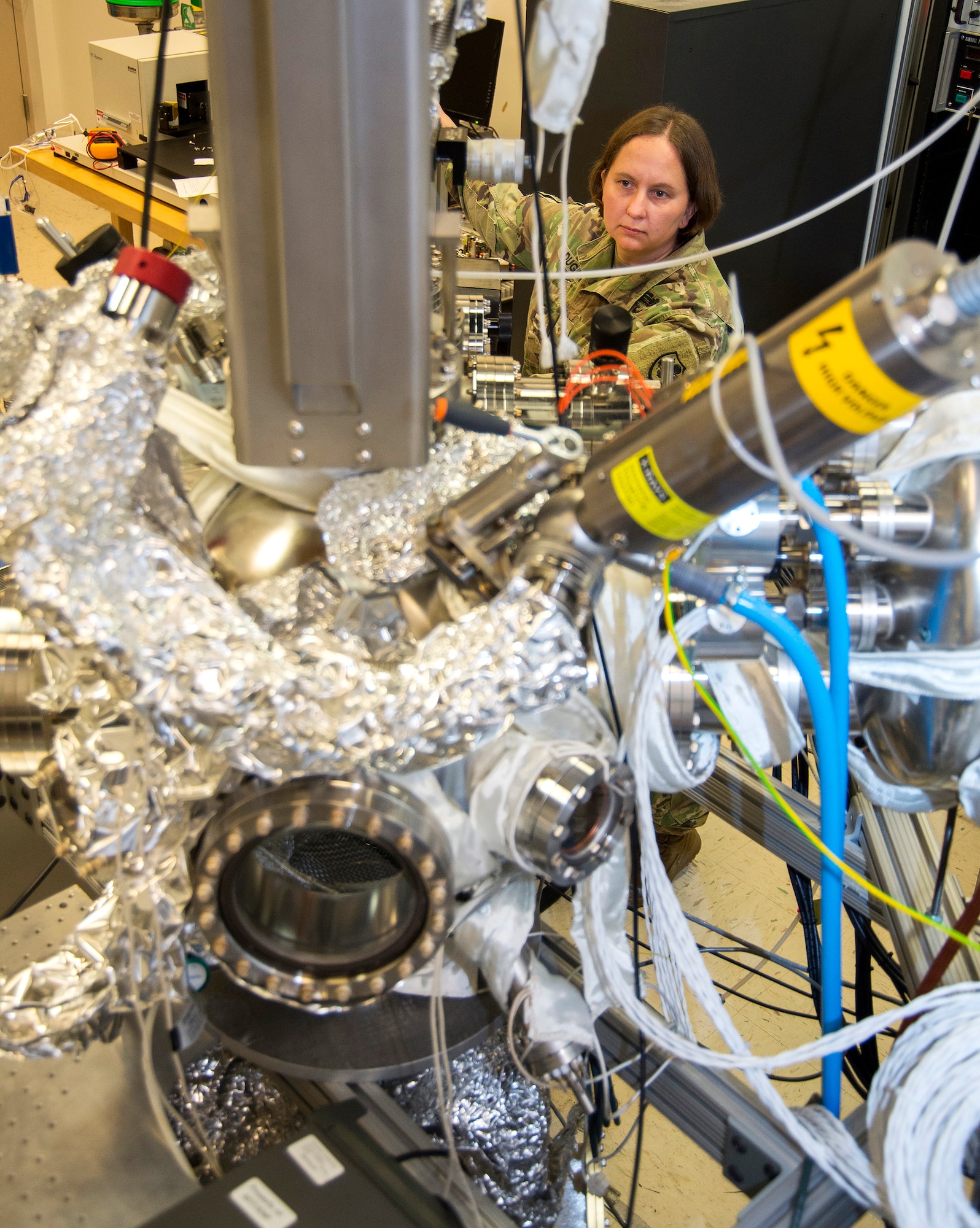 U.S. Army Maj. Christina Dugan, a physics doctoral student, works on her research project at the Air Force Institute of Technology, Wright-Patterson Air Force Base, Ohio, June 21, 2017. (U.S. Air Force photo by R.J. Oriez)