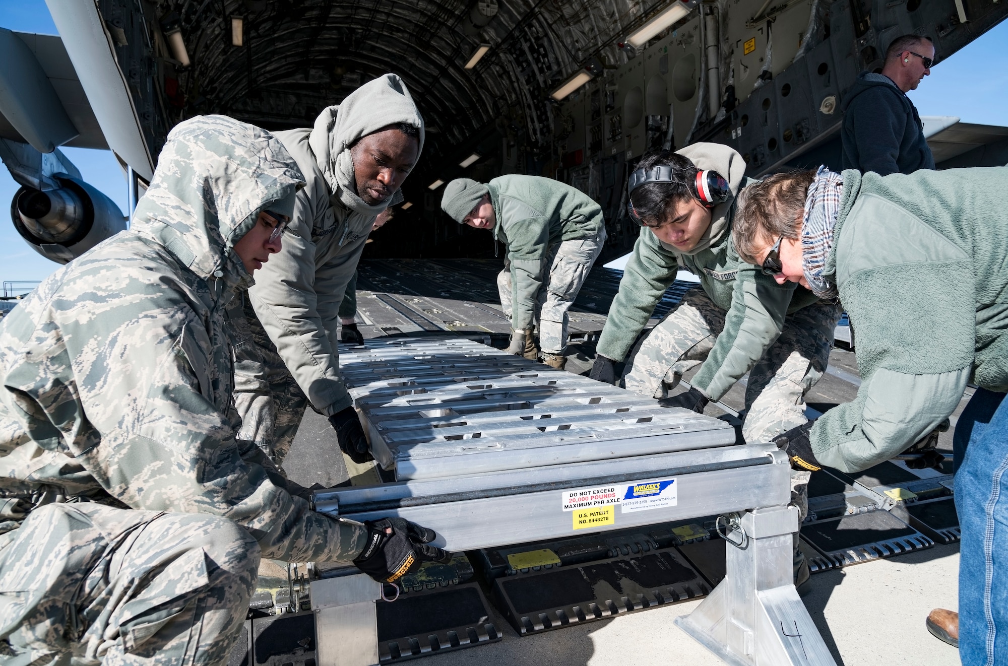 Ramp operations personnel assigned to the 436th Aerial Port Squadron assemble the ramp sections of DOMOPS Airlift Modular Approach Shoring Jan. 11, 2019, at Dover Air Force Base, Del. The modular shoring was used to upload five vehicles belonging to the Delaware National Guard's 31st Civil Support Team, Weapons of Mass Destruction headquartered in Smyrna, Del.