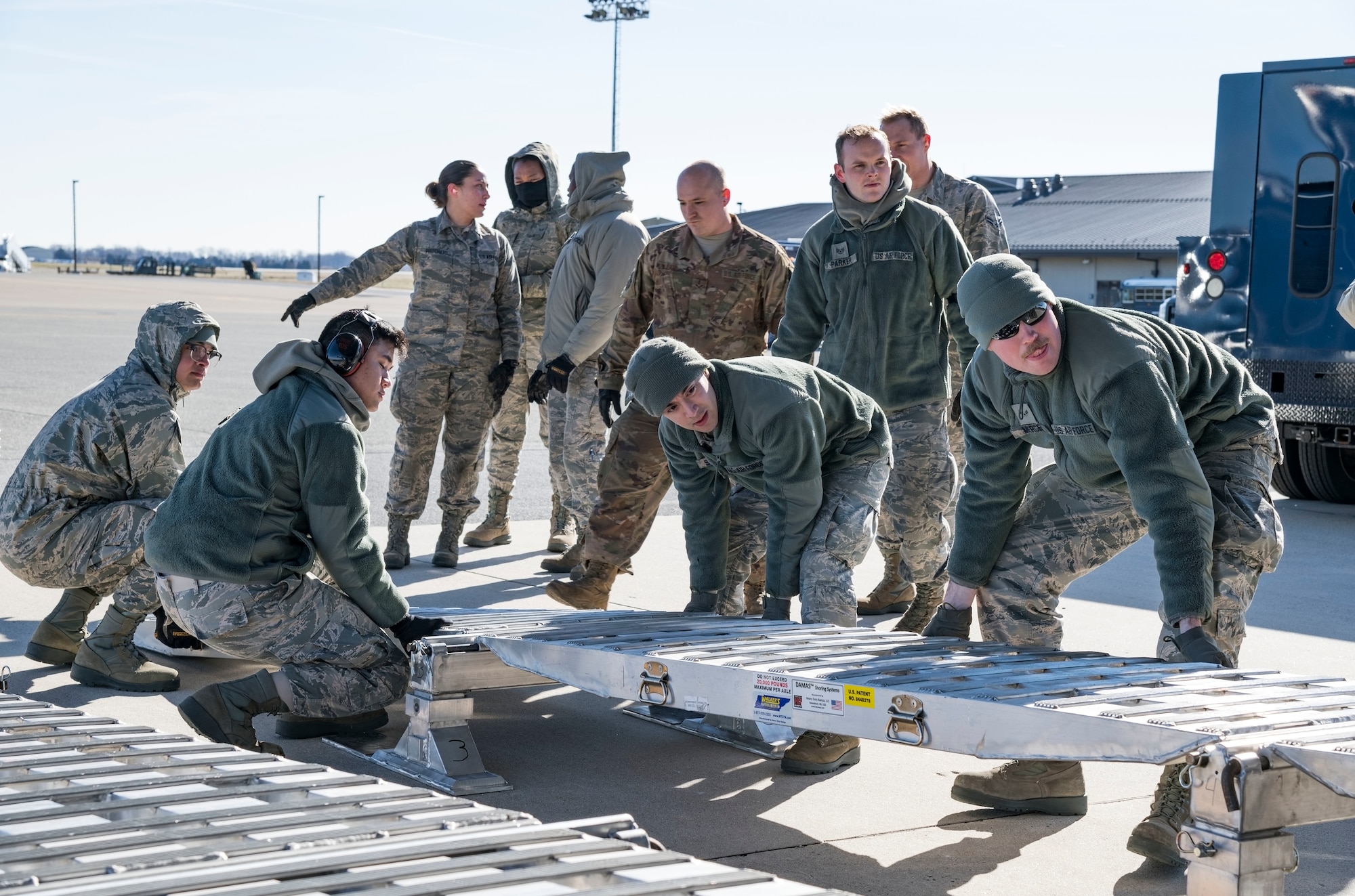 Ramp operations personnel assigned to the 436th Aerial Port Squadron position the DOMOPS Airlift Modular Approach Shoring up to the ramp of a C-17 Globemaster III from the 105th Airlift Wing, Stewart Air National Guard Base, Newburgh, N.Y., Jan. 11, 2019, at Dover Air Force Base, Del. The modular shoring was used to upload five vehicles belonging to the Delaware National Guard's 31st Civil Support Team, Weapons of Mass Destruction headquartered in Smyrna, Del. (U.S. Air Force photo by Roland Balik)