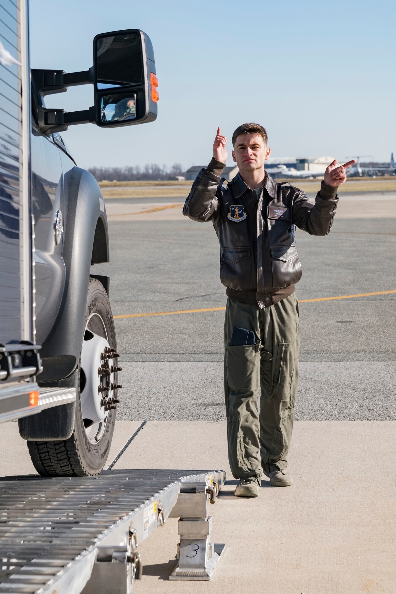 Staff Sgt. Ryan Stanich, 137th Airlift Squadron C-17 loadmaster, Stewart Air National Guard Base, Newburgh, N.Y., marshals a vehicle backing up on the DOMOPS Airlift Modular Approach Shoring Jan. 11, 2019, at Dover Air Force Base, Del. The Delaware National Guard's 31st Civil Support Team, Weapons of Mass Destruction headquartered in Smyrna, Del., were airlifted to Florida by a C-17 assigned to the 105th Airlift Wing, Stewart Air National Guard Base, Newburgh, N.Y., to support a large-scale training exercise Jan. 14-18. The 31st CST maintains the capability to mitigate the consequences of any WMD or Nuclear, Biological, and Chemical event, whether natural or man-made. They are experts in WMD effects and NBC defense operations. (U.S. Air Force photo by Roland Balik)