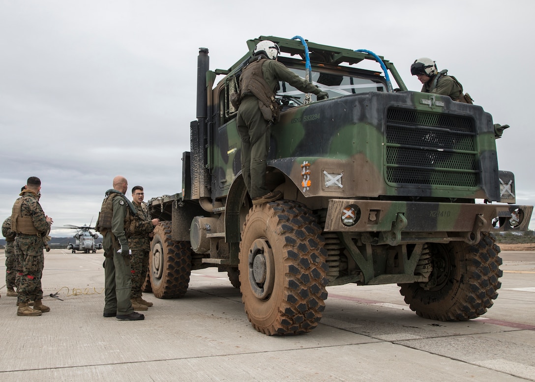 MARINE CORPS AIR STATION MIRAMAR, Calif.- U.S. Marines with Marine Heavy Helicopter Squadron (HMH) 462, Marine Aircraft Group (MAG) 16, 3rd Marine Aircraft Wing (MAW), and 1st Transportation Support Battalion (TSB), 1st Marine Logistics Group (MLG), prepare a Medium Tactical Vehicle Replacement (MTRV) to be lifted by a CH-53E Super Stallion at Marine Corps Air Station Miramar, Calif., Jan. 16. Marines from HMH-462 and 1st MLG conducted an external lift of an MTVR to improve their support capabilities and exercise the aircraft’s limit of 36,000 pounds. (U.S. Marine Corps photo by Lance Cpl. Clare J. McIntire)