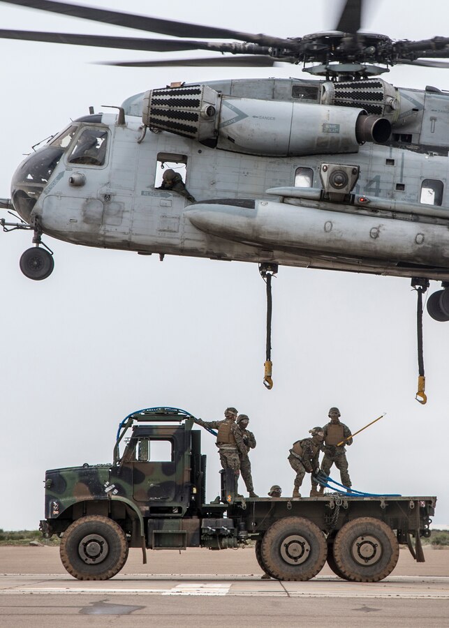 MARINE CORPS AIR STATION MIRAMAR, Calif.- U.S. Marines with 1st Transportation Support Battalion (TSB), 1st Marine Logistics Group (MLG), prepare to hook a Medium Tactical Vehicle Replacement (MTVR) to a CH-53E Super Stallion with Marine Heavy Helicopter Squadron (HMH) 462, Marine Aircraft Group (MAG) 16, 3rd Marine Aircraft Wing (MAW), at Marine Corps Air Station Miramar, Calif., Jan. 16. Marines from HMH-462 and 1st MLG conducted an external lift of an MTVR to improve their support capabilities and exercise the aircraft’s limit of 36,000 pounds. (U.S. Marine Corps photo by Lance Cpl. Clare J. McIntire)