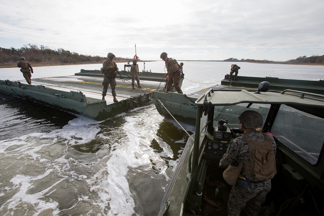 Marines construct a floating bridge system