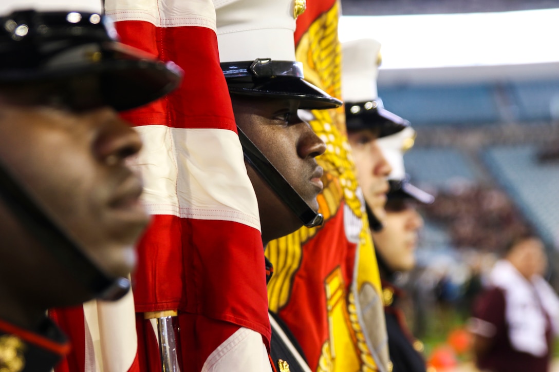 Recruiting Station Jacksonville’s color guard stages for the National Anthem during the pre-game show of TaxSlayer Gator Bowl, Dec. 31, 2018, at TIAA Bank Field in Jacksonville, Florida. The Parris Island Marine Band performed the National Anthem for the fans of Texas A&M University and North Carolina State University. (U.S. Marine Corps Photo by Cpl. Mike Hernandez)