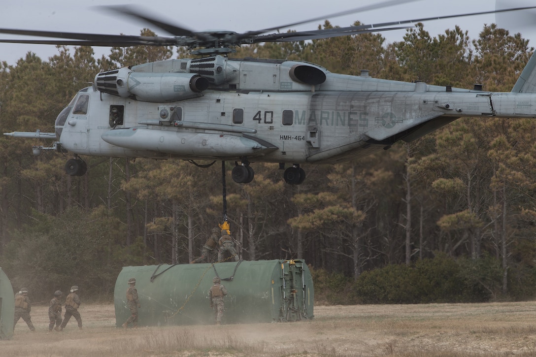 Marines deploy a section of a floating bridge