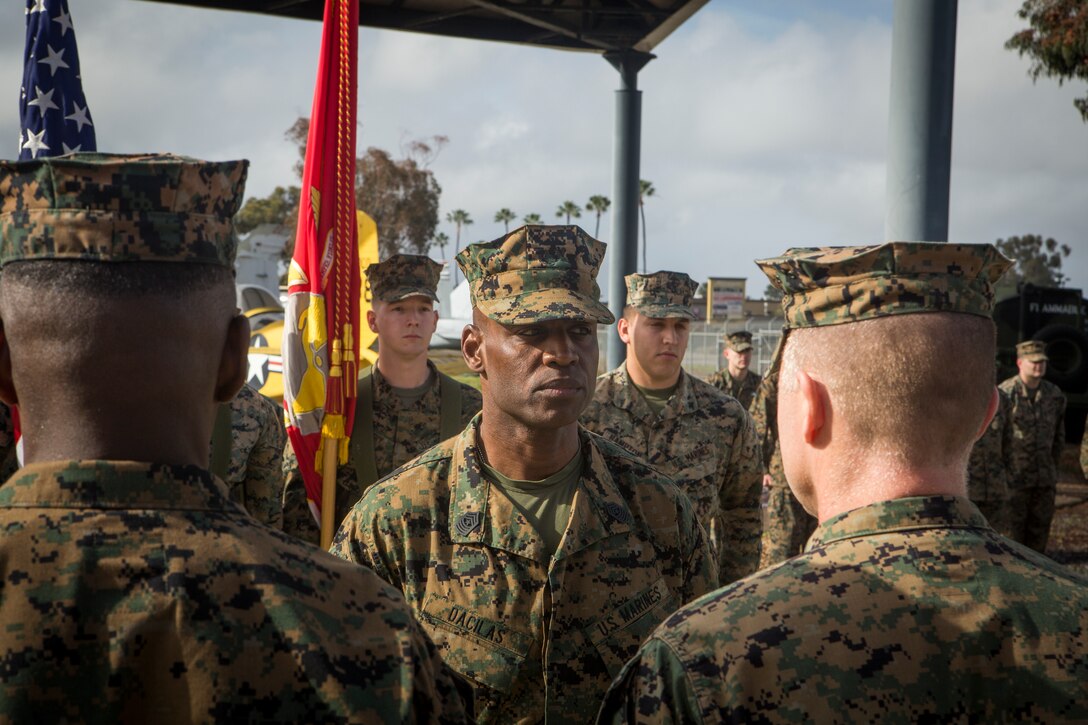 Sgt. Maj. Pascal Dacilas, former Sergeant Major of Marine Aircraft Group (MAG) 41 Detachment Bravo, stands at attention while receiving awards during a relief and appointment ceremony on Marine Corps Air Station Miramar, Calif., Jan. 18. The ceremony officially recognized Dacilas for his years of honorable service to the Marine Corps and his time as the sergeant major of MAG-41 Detachment Bravo from February 2017 through January 2019. (U.S. Marine Corps photo by Cpl. Becky Cleveland)