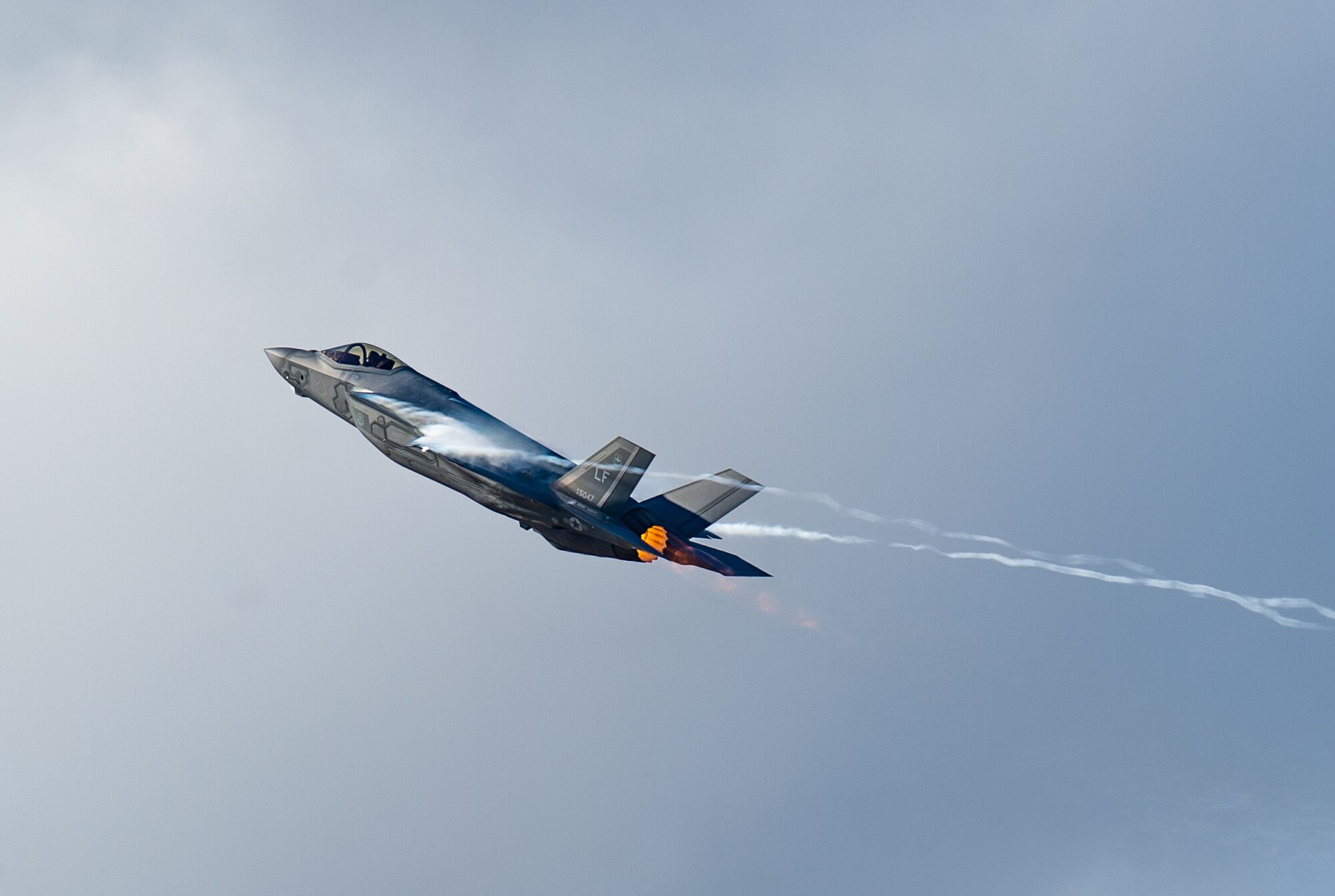 Capt. Andrew “Dojo” Olson, F-35 Demonstration Team pilot and commander performs a high-speed vertical climb during an F-35 Demo practice at Luke Air Force, Base. Ariz., Jan. 16, 2019. The new aerobatic demonstration consists of 14 maneuvers which will showcase the F-35A Lightning II’s raw power and precision. (U.S. Air Force photo by Senior Airman Alexander Cook)