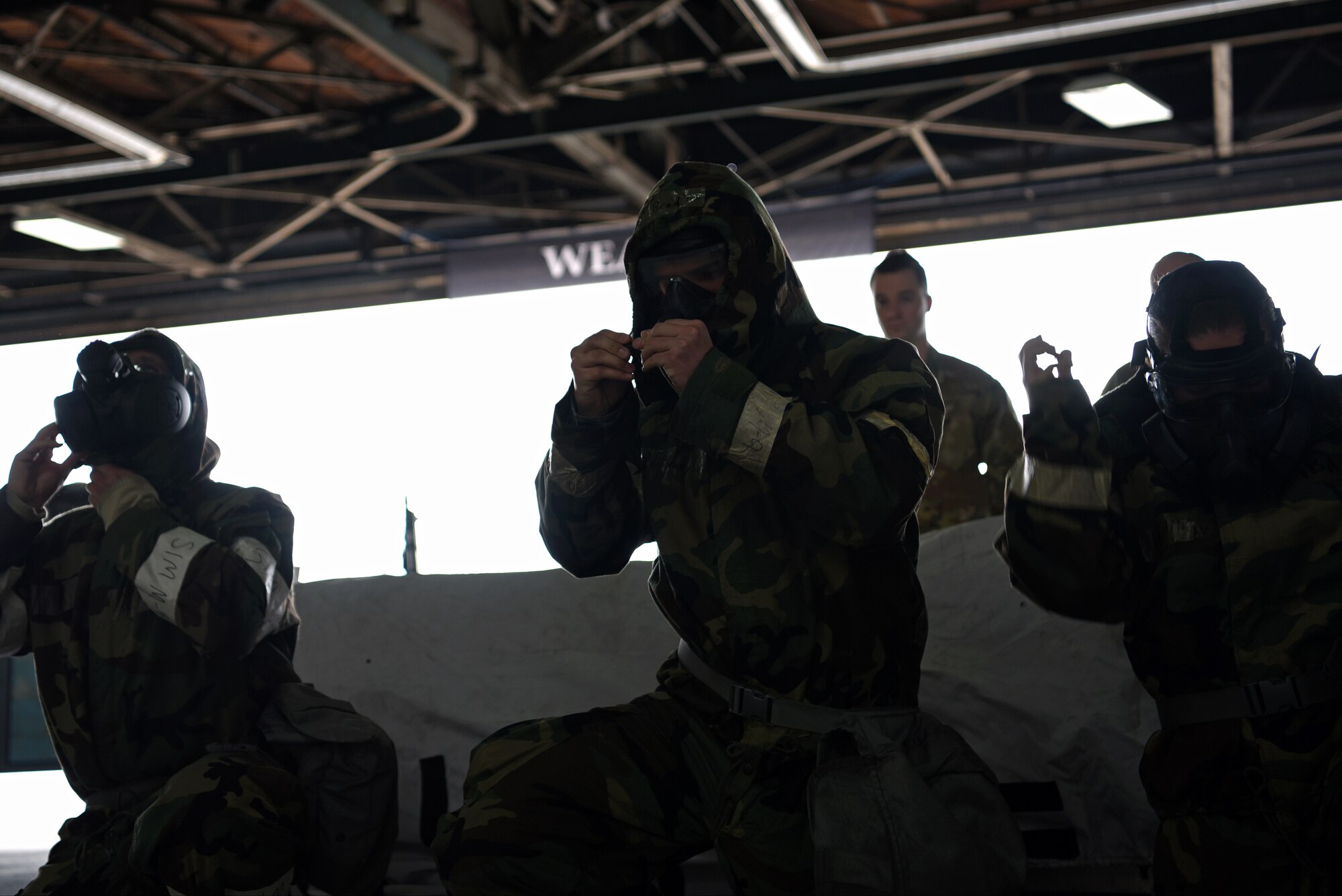 A load crew from the 20th Aircraft Maintenance Squadron, 79th Aircraft Maintenance Unit, don Mission-Oriented Protective Posture gear during a quarterly load crew competition at Shaw Air Force Base, S.C., Jan. 18, 2019.
