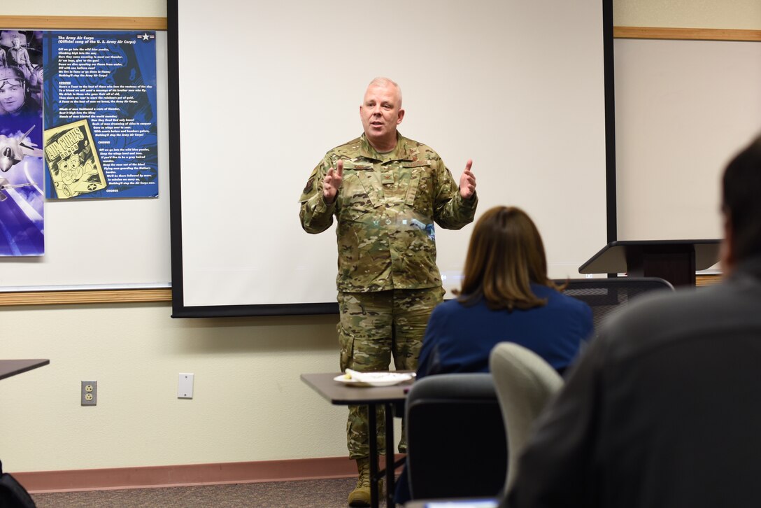 U.S. Air Force Col. Christopher King, 377th Air Base Wing vice commander, speaks during the opening remarks of a “Show and Tell” event at Kirtland Air Force Base, N.M., Jan. 18, 2019. The event gave school counselors from the Albuquerque Public School system the chance to sit down with base employees to discuss opportunities available to students. (U.S. Air Force photo by Senior Airman Eli Chevalier)