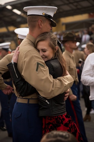 A Marine with Delta Company, 1st Recruit Training Battalion, reunites with a loved one after graduating from recruit training at Marine Corps Recruit Depot San Diego, Jan. 11, 2019.
