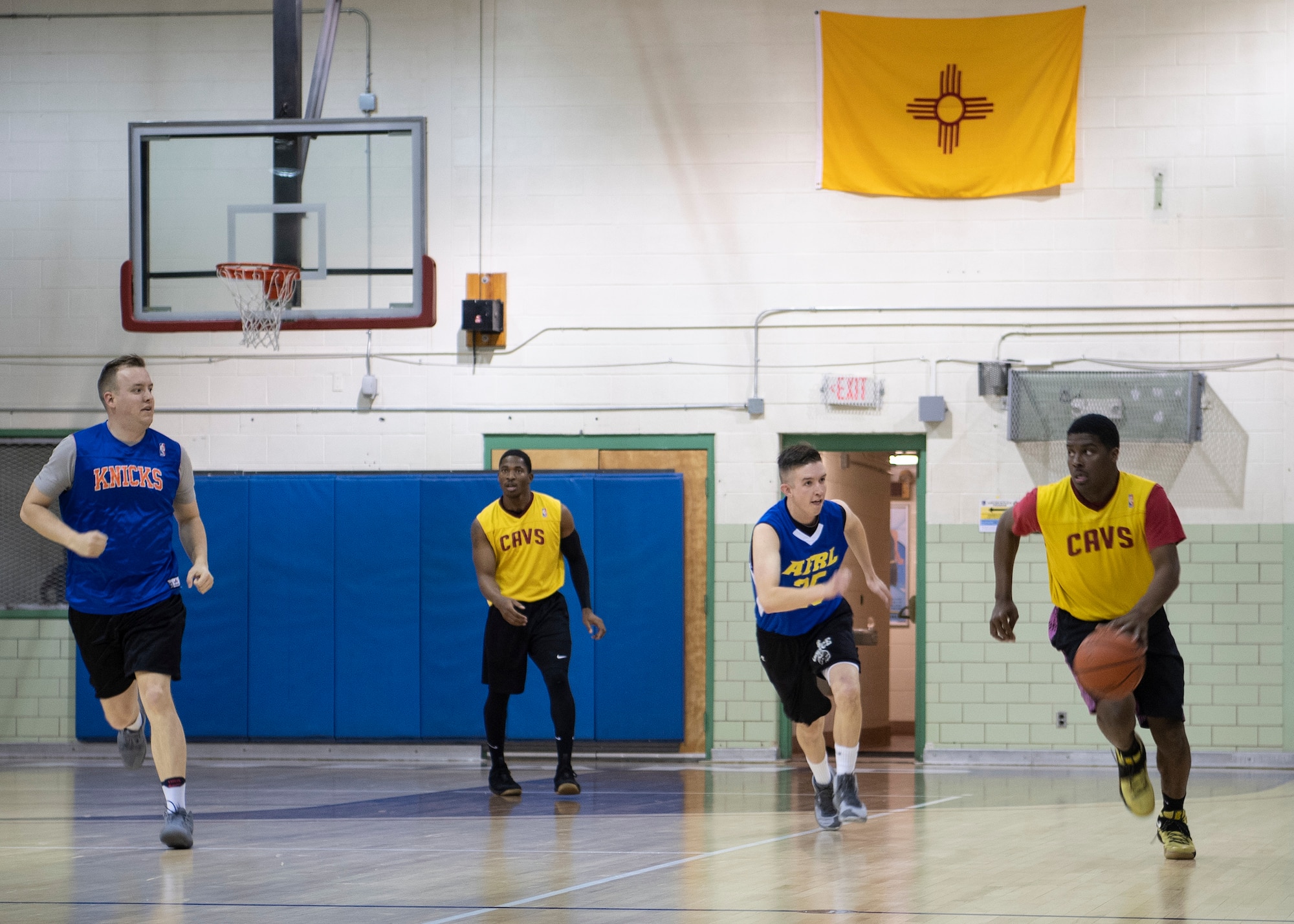 WSSS-Lopez guard Airman 1st Class Yaukis Cole performs a lay-up against AFRL defenders in an intramural basketball contest at Kirtland Air Force Base, N.M., Jan. 17, 2019. Despite a seven-point performance by Cole, WSSS-Lopez were defeated by AFRL, 41-47. (U.S. Air Force photo by Staff Sgt. J.D. Strong II)