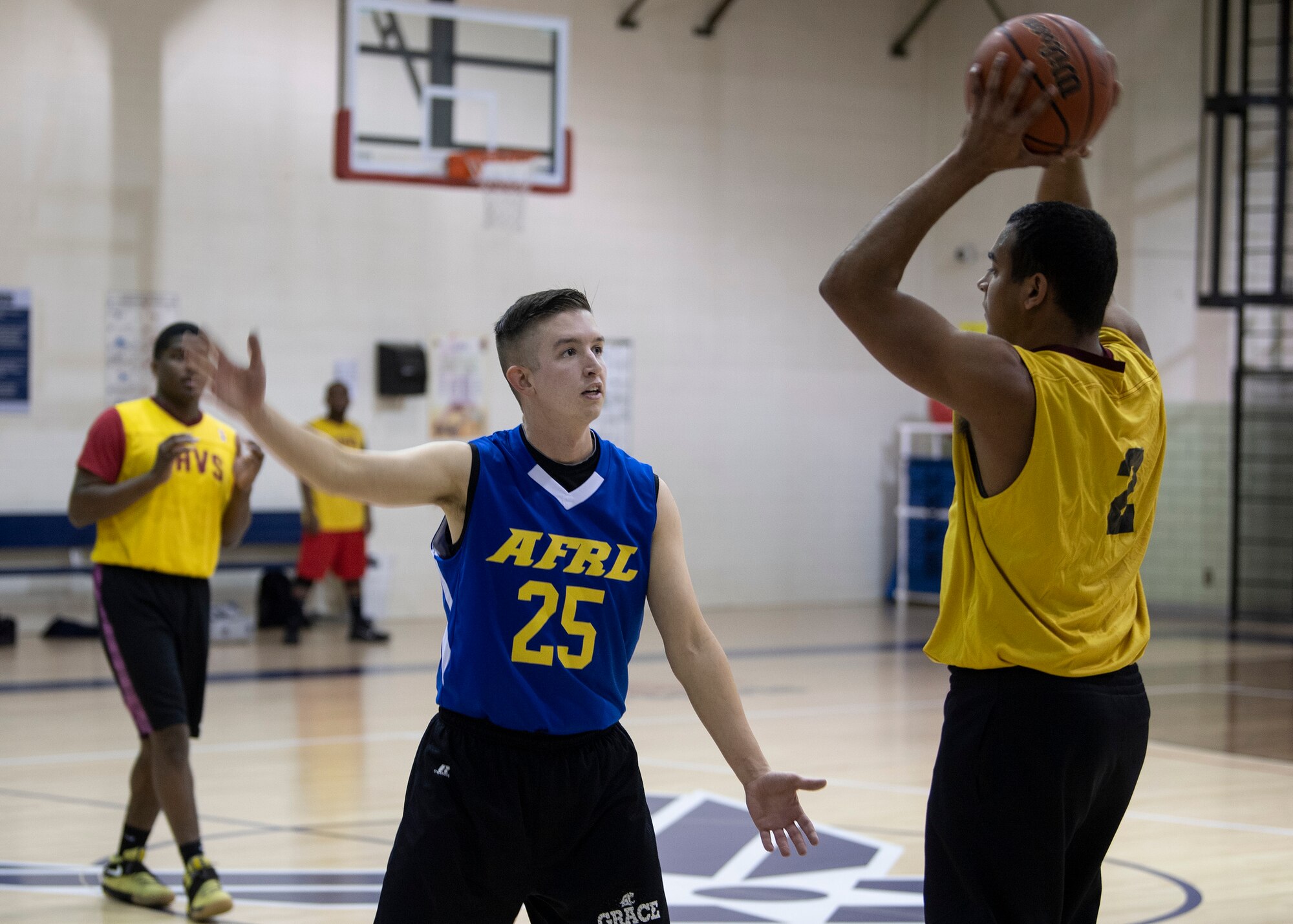 AFRL guard 1st Lt. Brennan Taylor tries to intercept an inbounds pass from WSSS-Lopez forward SrA Khalil Walton in an intramural basketball contest at Kirtland Air Force Base, N.M., Jan. 17, 2019. Taylor and AFRL defeated WSSS-Lopez in an upset victory 47-41. (U.S. Air Force photo by Staff Sgt. J.D. Strong II)