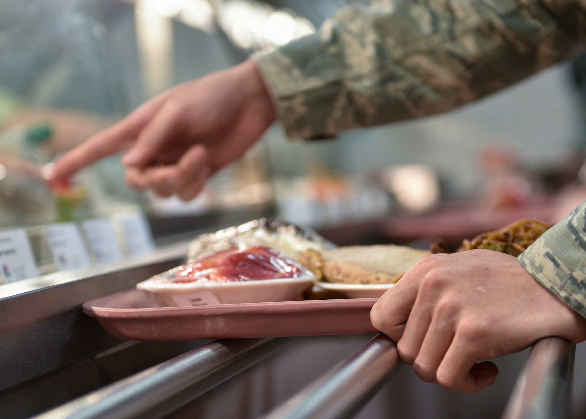 A patron of Thunderbird Inn points to his entree selection at Kirtland Air Force Base, N.M., Jan. 22, 2019. The Hennessy Award Program recognizes exceptional food service support within the Air Force. (U.S. Air Force photo by Airman 1st Class Austin J. Prisbrey)
