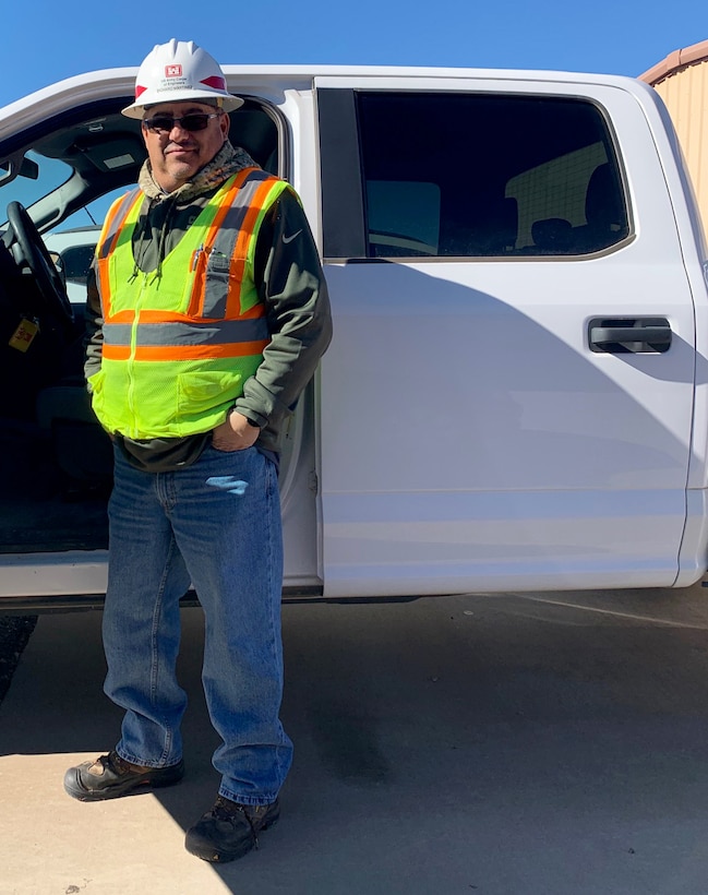 Richard Martinez, the District’s Field Employee of the Year, stands next to his truck before heading out on a site visit, Jan. 3, 2019.