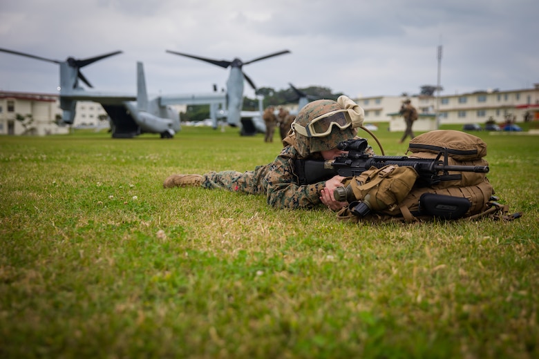 Lance Cpl. Amber M. Laflamme provides security during helicopter support team training at Camp Foster, Okinawa, Japan, Jan. 14, 2019. Landing Support Company, 3rd Transportation Support Battalion, Combat Logistics Regiment 3, 3rd Marine Logistics Group supported Marine Medium Tiltrotor Squadron 265, Marine Aircraft Group 36, 1st Marine Aircraft Wing during external lift training, which ensures pilots and landing support specialists are able to communicate as well as transport gear from one location to another. Laflamme, a landing support specialist, is a native of Rutland, Vermont. (U.S. Marine Corps Photo by Cpl. André T. Peterson Jr.)