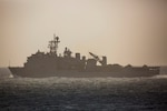 PACIFIC OCEAN (April 30, 2018) File Photo of the Whidbey Island-class amphibious dock landing ship USS Rushmore (LSD 47) splits away from the Wasp-class amphibious ship USS Essex (LHD 2) while conducting a strait transit exercise in support of Amphibious Ready Group (ARG), Marine Expeditionary Unit (MEU) Exercise (ARGMEUEX). ARGMEUEX provides essential and realistic ship-to-shore training designed to enhance the integration of the Navy-Marine Corps team.(U.S. Marine Corps photo by Cpl. Francisco J. Diaz Jr./Released)