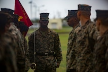 Sgt. Kirk Broxton looks over his Marines during a drill competition Jan. 16, 2019 at Roberts Field, Camp Kinser, Okinawa, Japan. Close order drill is conducted by the Navy and Marine Corps to teach simple formations, discipline and small unit leadership. This is the first drill competition Combat Logistics Regiment 35, Supply Battalion has hosted and it will be held quarterly. Broxton, an Inventory Specialist with Supply Company, Supply Bn., is a native of Atlanta, Georgia. (U.S. Marine Corps photo by Lance Cpl. Jamin M. Powell)
