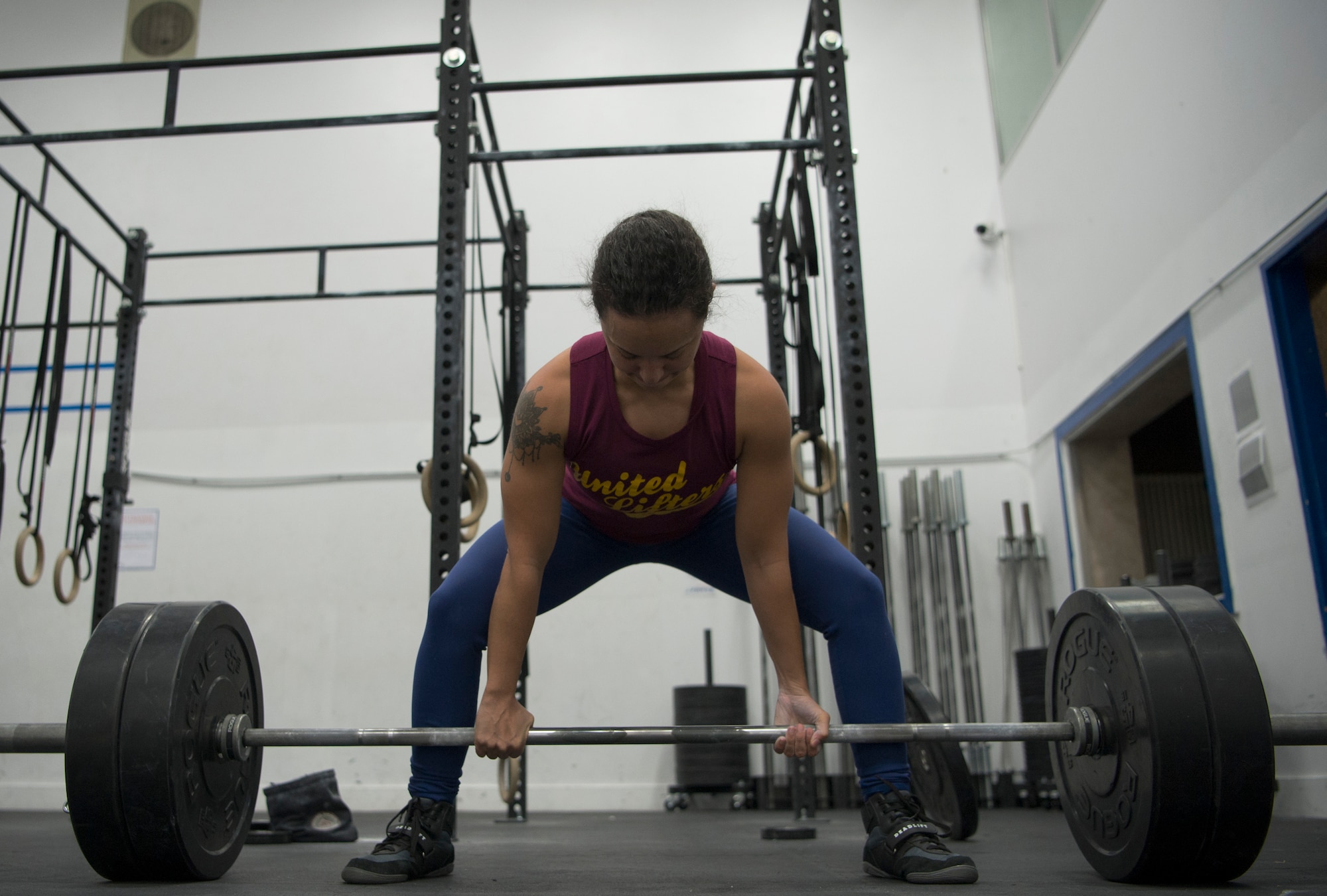 Deadlifting weights is performed in the standing position with weights on a bar which is lifted from the ground to the hips