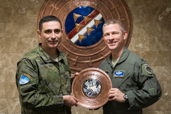 U.S. Air Force Col. Britt Hurst, 39th Air Base Wing commander, and Spanish army Lt. Col. Jose Alberto Munoz Martinez, Spanish Patriot Unit commander, pose during a going-away gift exchange at Incirlik Air Base, Turkey, Jan. 16, 2019.