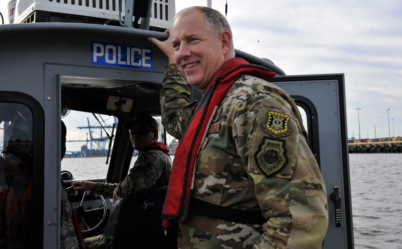 Maj. Gen. John Gordy, U.S. Air Force Expeditionary Center commander, prepares to take the helm during a harbor security patrol boat tour Jan. 17, 2019, at Joint Base Charleston, S.C.