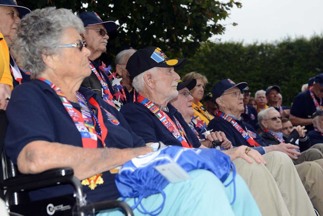 A group of people sitting in wheelchairs.