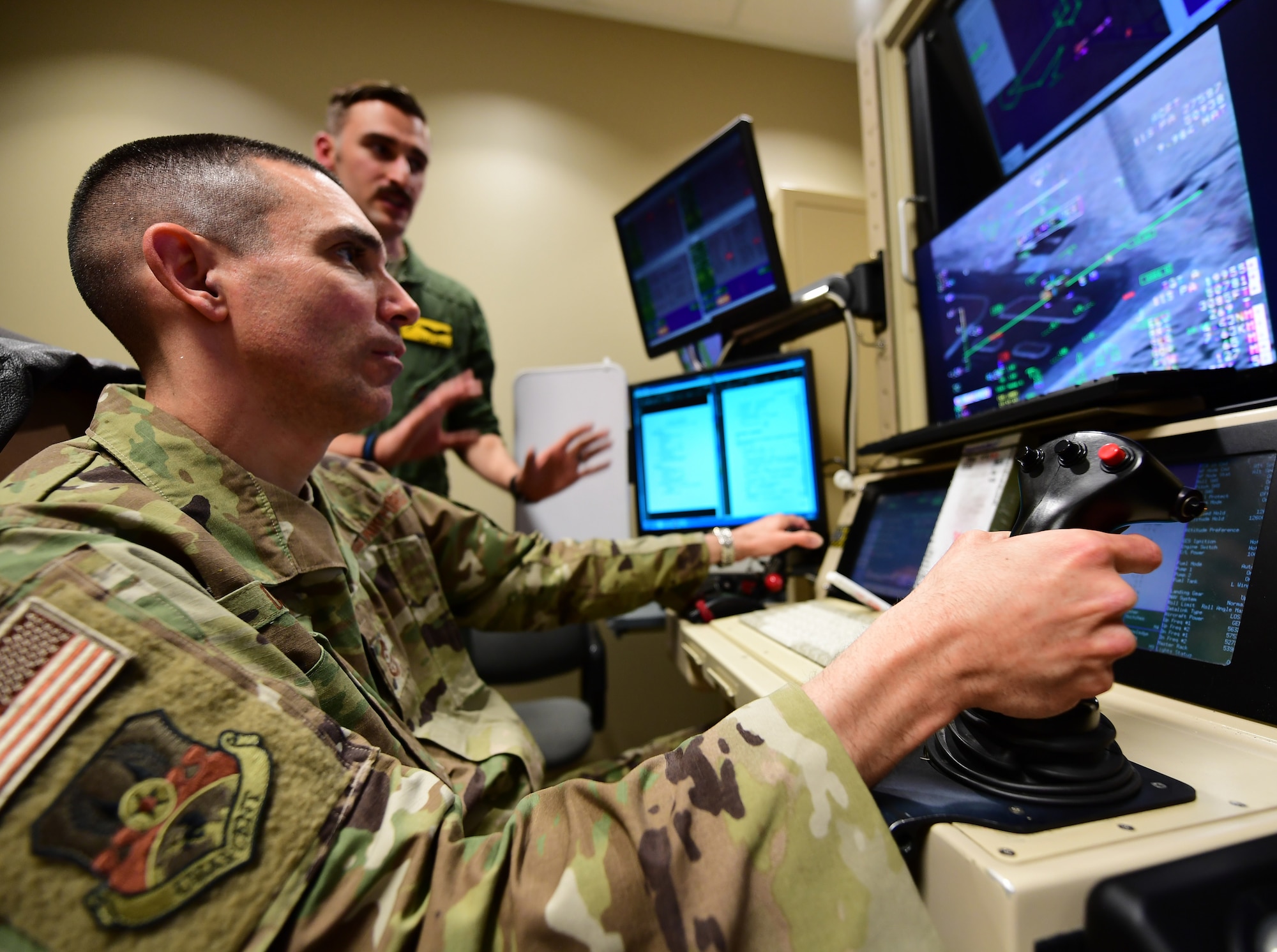 U.S. Air Force Chief Master Sgt. Shawn Drinkard, U.S. Air Forces Central Command command chief, pilots a simulated Reaper in a flight simulator, at Creech Air Force Base, Nevada, Jan. 16, 2019. These simulators ensure Reaper pilots and sensor operators remain current with flight training and utilize skills in realistic combat situations. (U.S. Air Force photo by Senior Airman Christian Clausen)