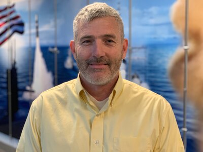 John Hamilton is a physicist and Branch Manager at Naval Surface Warfare Center, Crane Division (NSWC Crane), but once a month, he drives hundreds of miles to Des Moines, Iowa to serve as an Officer in Charge of a Navy Reserve Unit.