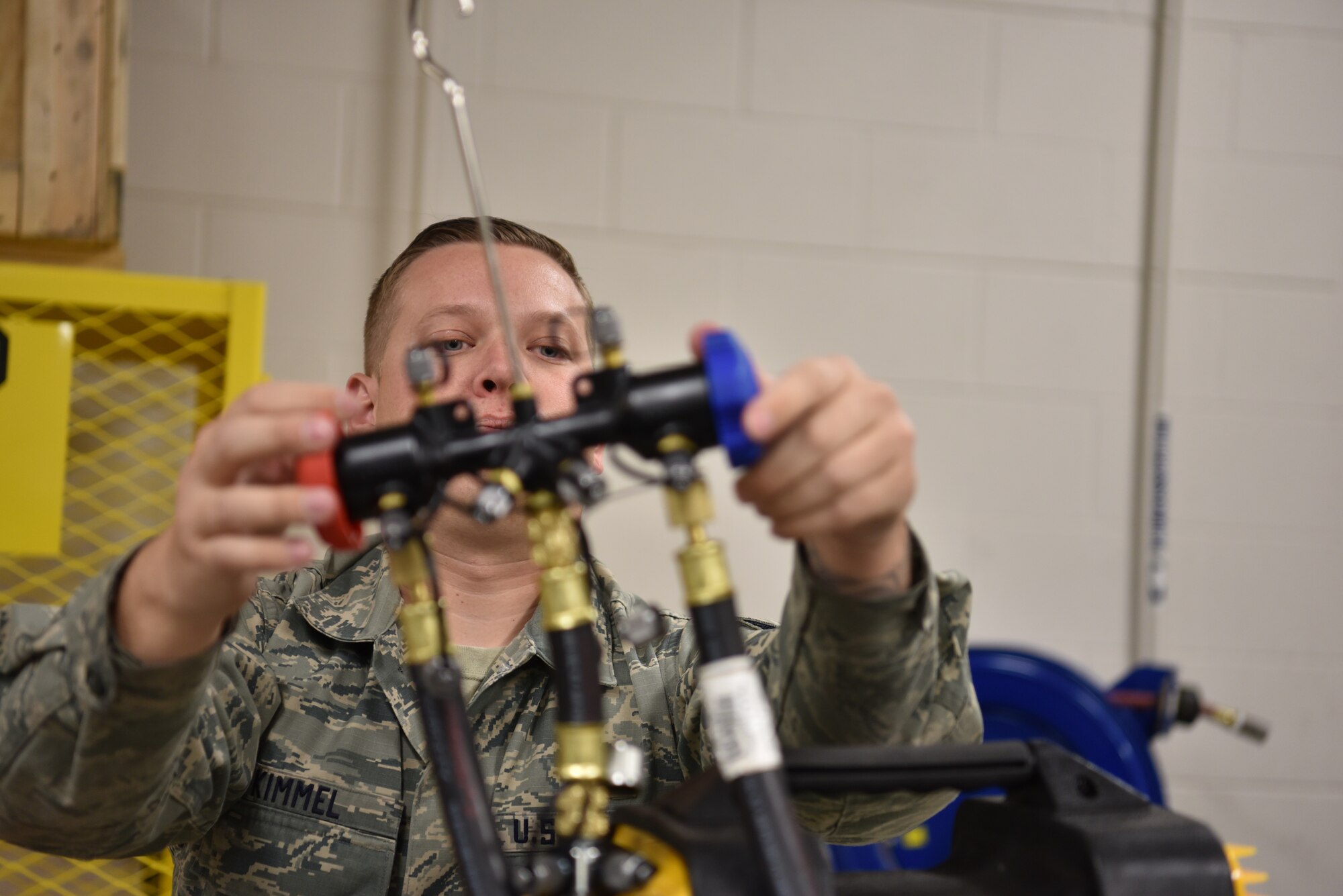 Staff Sgt. Ben Kimmel, 90th Maintenance Group power refridgeration and electrical production supervisor, puts together equipnment to service a brine chiller Dec. 17, 2018, at F.E. Warren Air Force Base, Wyo. These brine chillers are powerful air conditioners used in Missiler Alert Facilities and are critical due to the high temperatures put off by various equipnment in a MAF. (U.S. Air Force photo by Senior Airman Abbigayle Williams)