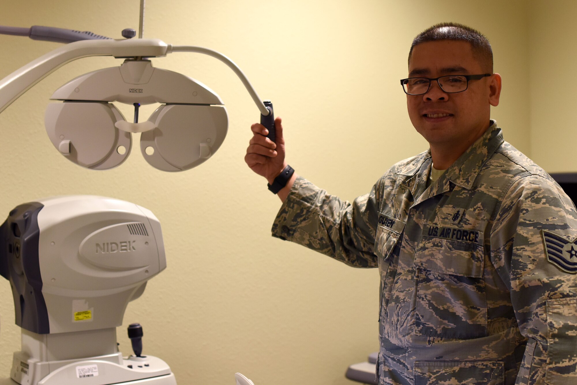 U.S. Air Force Tech Sgt. Vhin Nguyen, 17th Medical Operations Squadron medical services flight chief, shows the type of equipment used in the optometry clinic on Goodfellow Air Force Base, Texas, Jan. 23, 2019. Nguyen is the featured spotlight highlighting Airmen on Goodfellow and the different ways that they contribute to the 17th Training Wing and the base. (U.S. Air Force photo by Senior Airman Seraiah Hines/Released)
