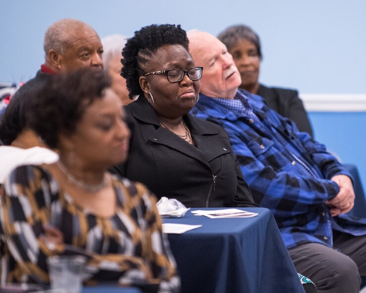 A woman in the crowd holds back tears as Rev. Dr. Harry Blake, local civil rights pioneer, shares his story of growing up in the South during the Civil Rights era at Barksdale Air Force Base, La., Jan. 18, 2019. Blake discussed his childhood on a plantation and how he became a leader alongside Martin Luther King Jr. (U.S. Air Force photo by Airman 1st Class Lillian Miller)